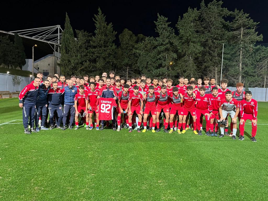 Sam Bartolo with Malta National Team squad on field